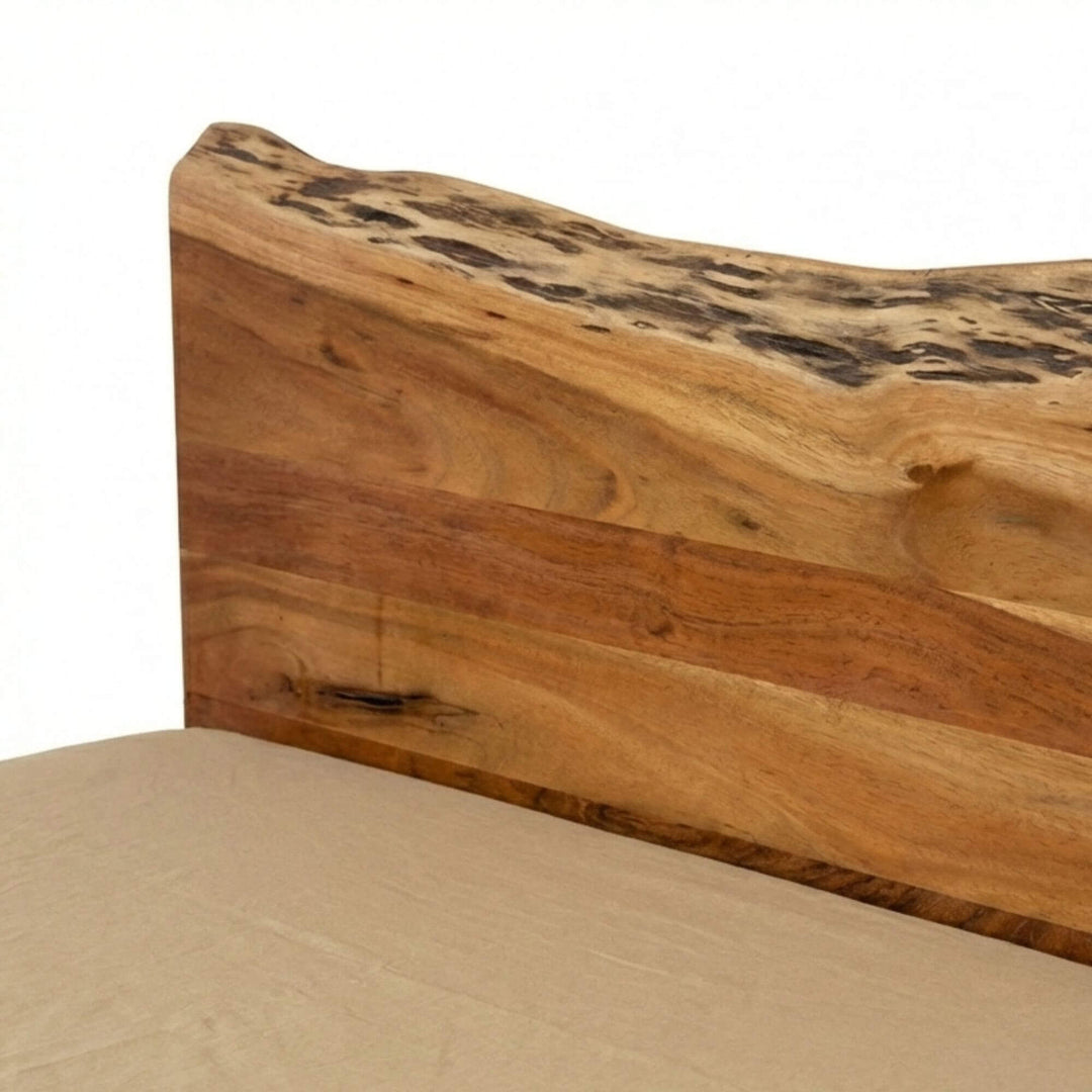 Close-up of the acacia wood bed frame highlighting natural grain, knots, and live-edge detail.