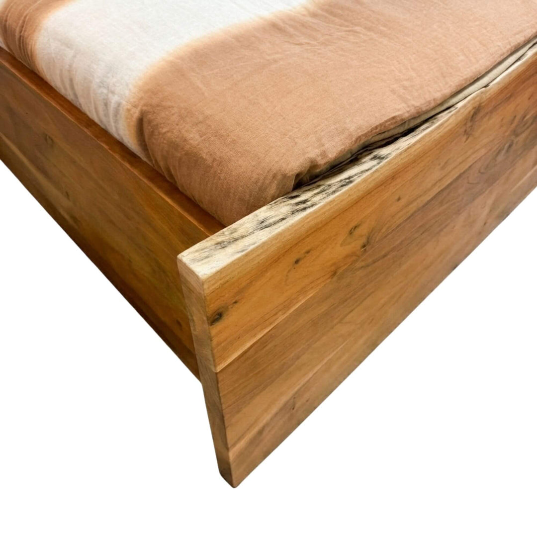 Close-up of the acacia wood bed frame highlighting natural grain, knots, and live-edge detail.