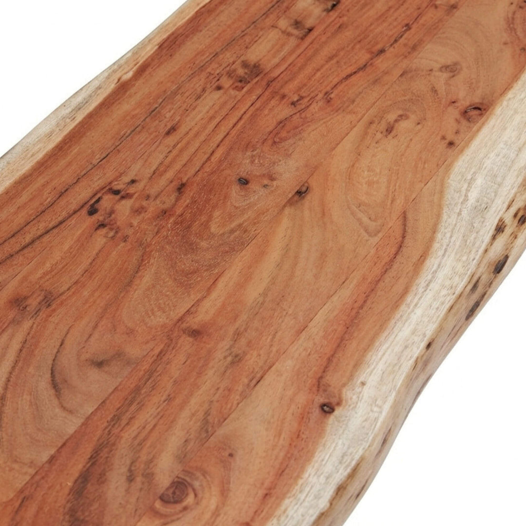 Close-up detail of the acacia wood grain and natural edge finish.