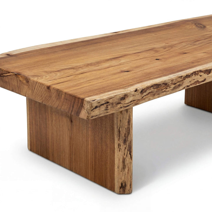 Side view showing the thick solid wood tabletop and legs.