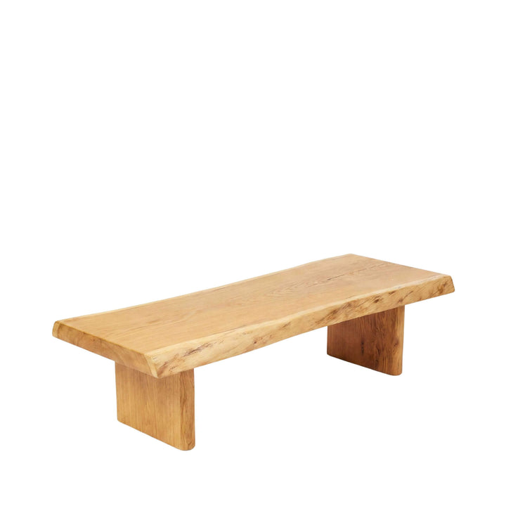 Front view of the acacia coffee table showing its solid wood top and sturdy block legs.