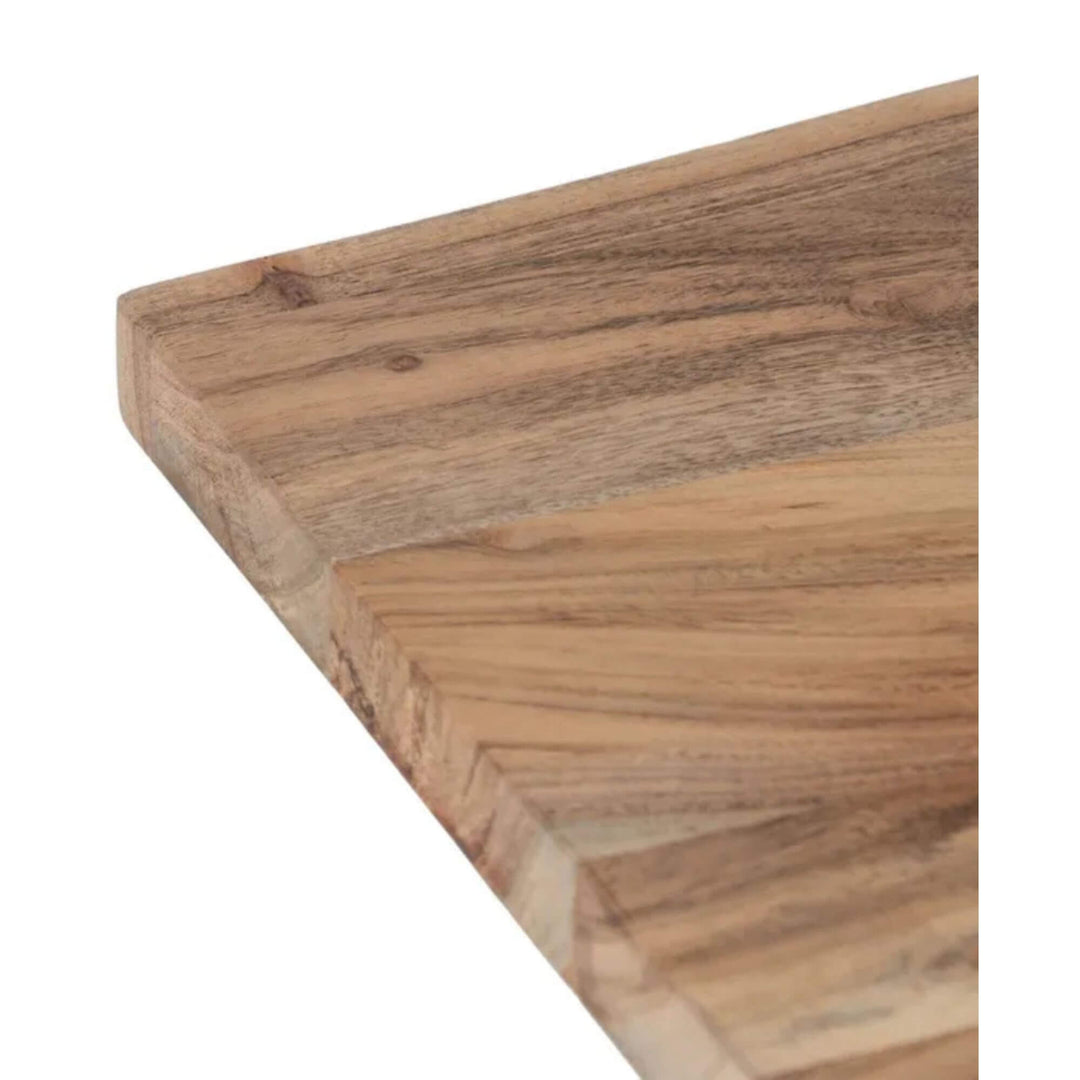 Corner detail of the acacia wood tabletop with visible wood grain and soft curves.