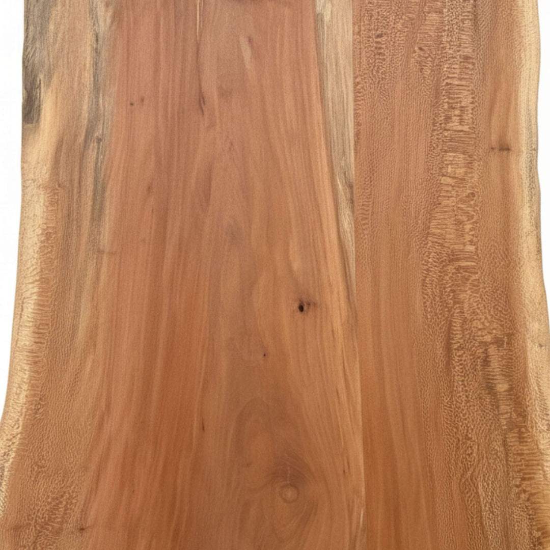 Close-up of the live-edge detailing on the acacia wood tabletop.