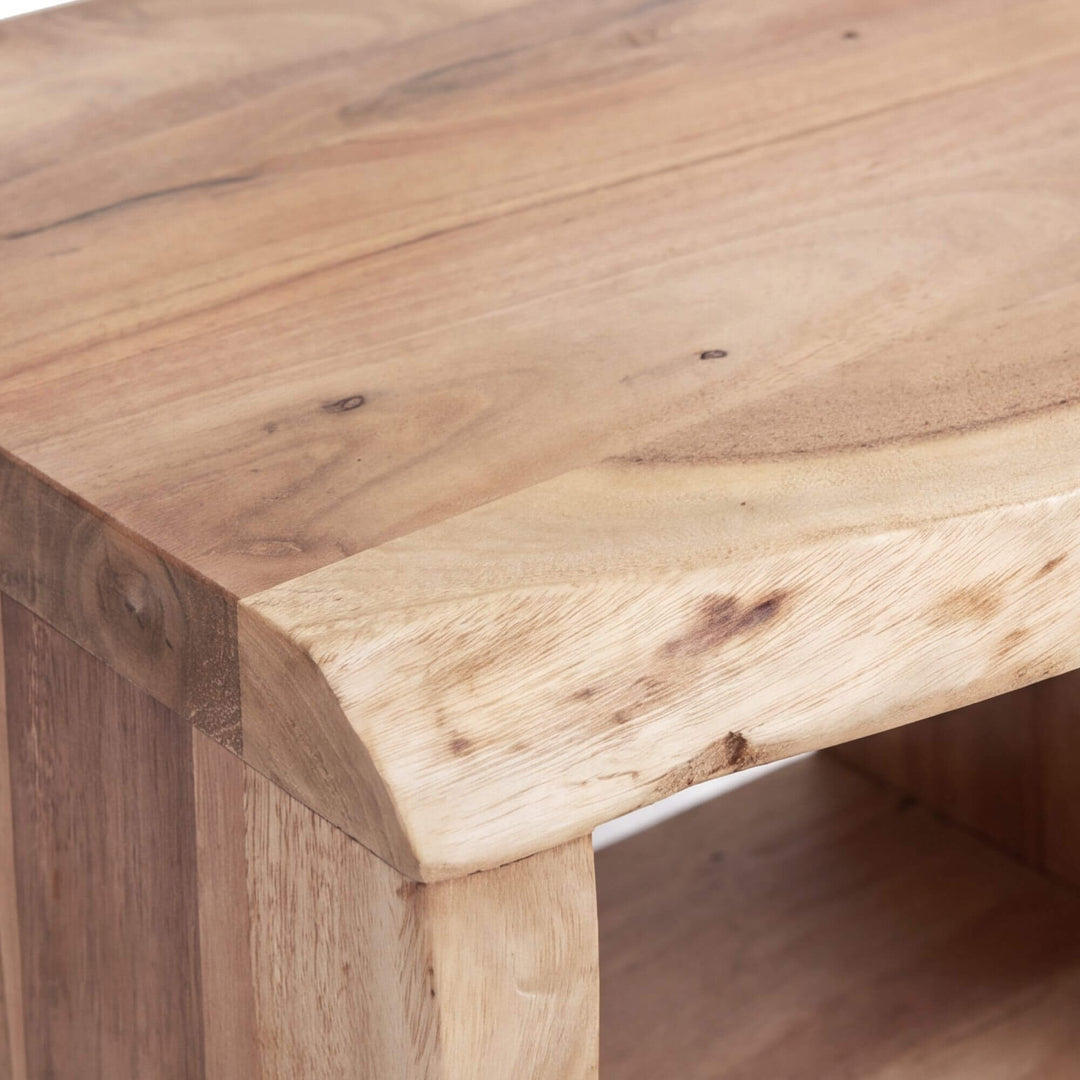 Close-up of the Acacia Edge bedside table highlighting the natural grain, knots, and organic wood edge