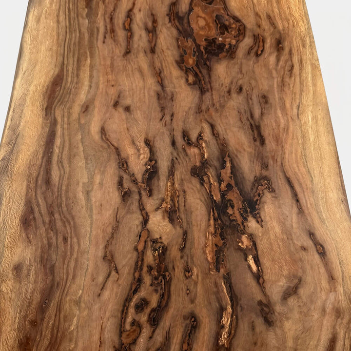 Detail view of the Acacia Wood Bench showing the rich acacia grain, knots, and natural tonal variations