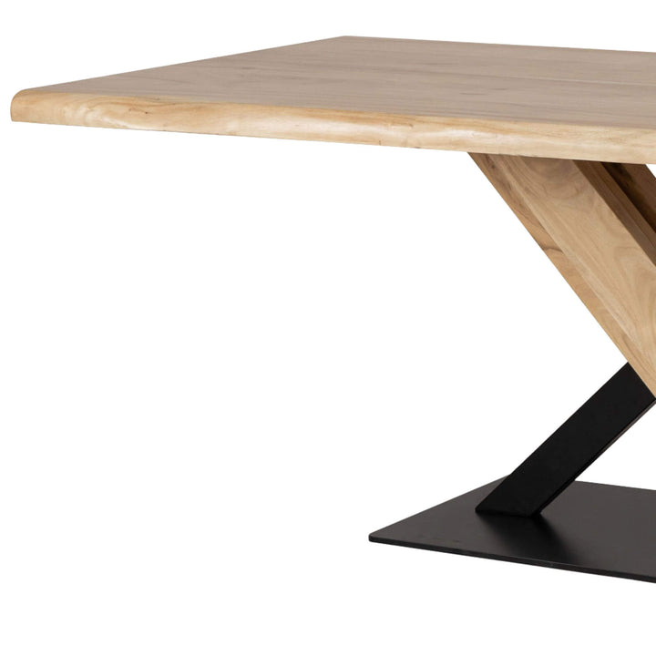 Side view of the Acacia “X” Dining Table showing solid acacia surface and metal structure.