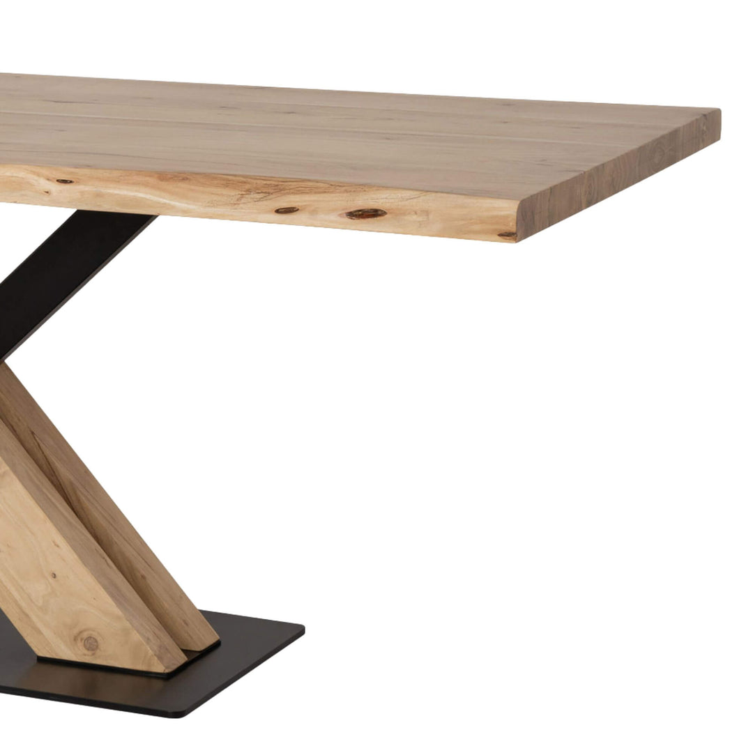 Side view of the Acacia “X” Dining Table showing solid acacia surface and metal structure.