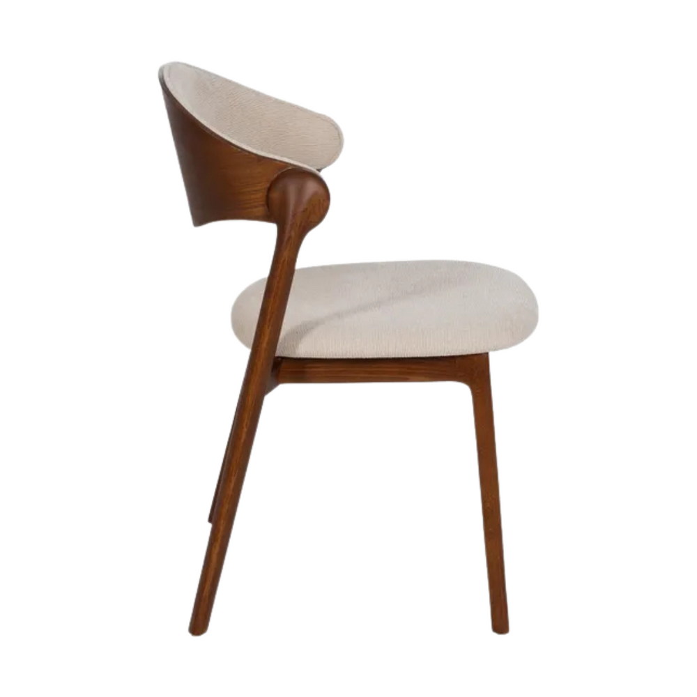 Side profile of Acra dining chair with curved oak backrest and fabric seat.