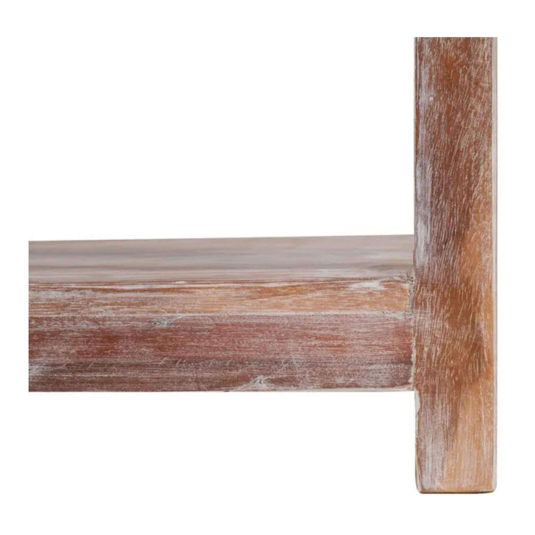 Close-up of the lower shelf and leg of the Adrastea Side Table, showing its whitewashed mango wood texture.