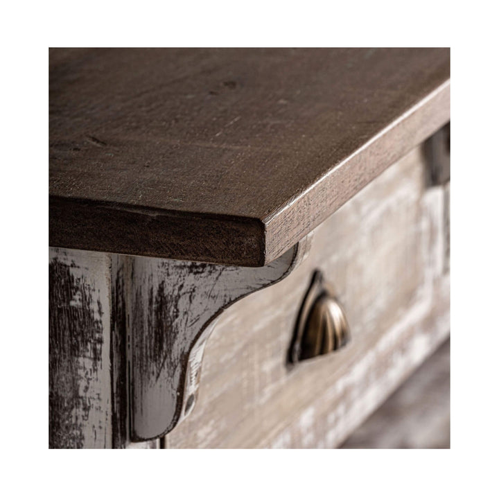Close-up of the dark brown mango wood top of the Adrastea wardrobe showing its smooth surface and detailed craftsmanship.