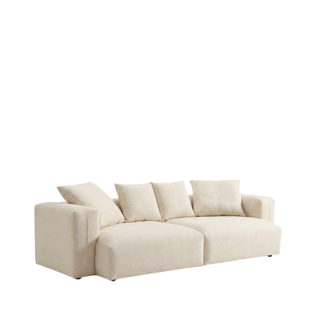 Front view of the Adri sofa showcasing its oversized shape and relaxed cushions in a light neutral fabric.