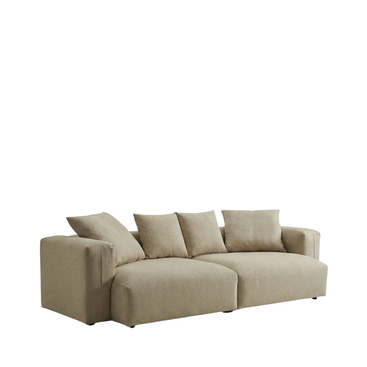 Front view of the Adri sofa showcasing its oversized shape and relaxed cushions in a light neutral fabric.
