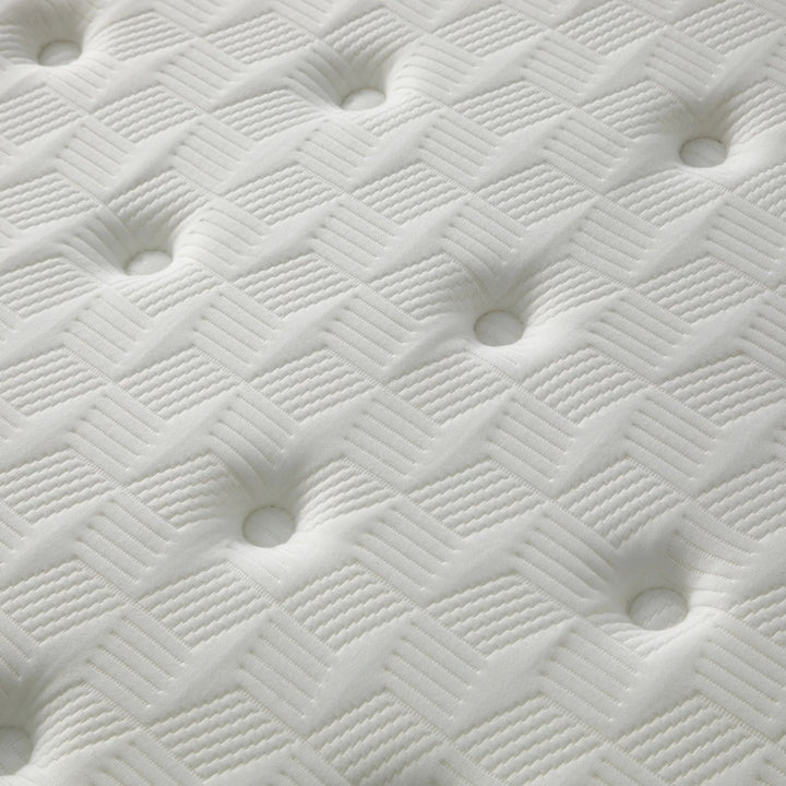 Close-up view of the mattress surface highlighting stitching, breathability, and SuperStretch fabric texture.