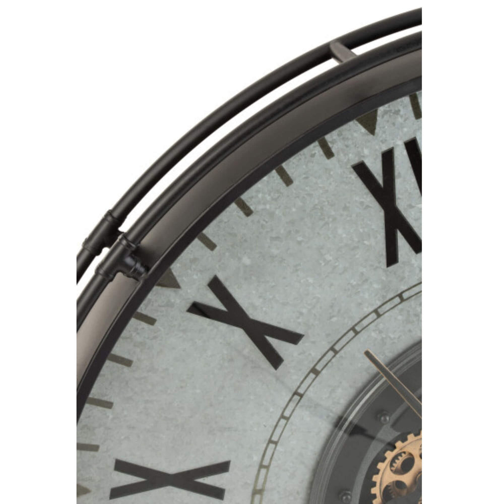 Close-up of the Aion Roman Clock showing the metal frame and Roman numerals.