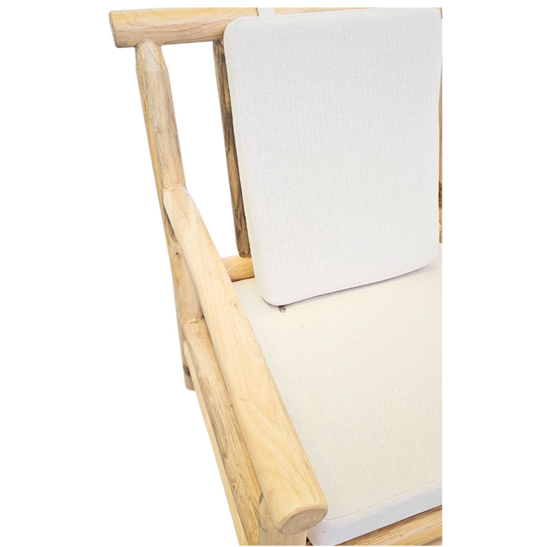 Close-up of the cream cushion attached to the teak branch backrest.