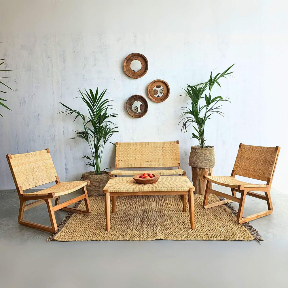 Akrasia coffee table styled with matching teak and rattan seating set