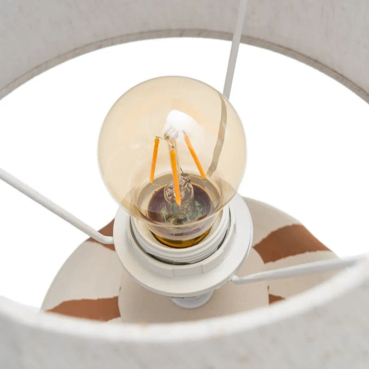 Close-up view of the bulb holder and interior structure of the lamp shade.