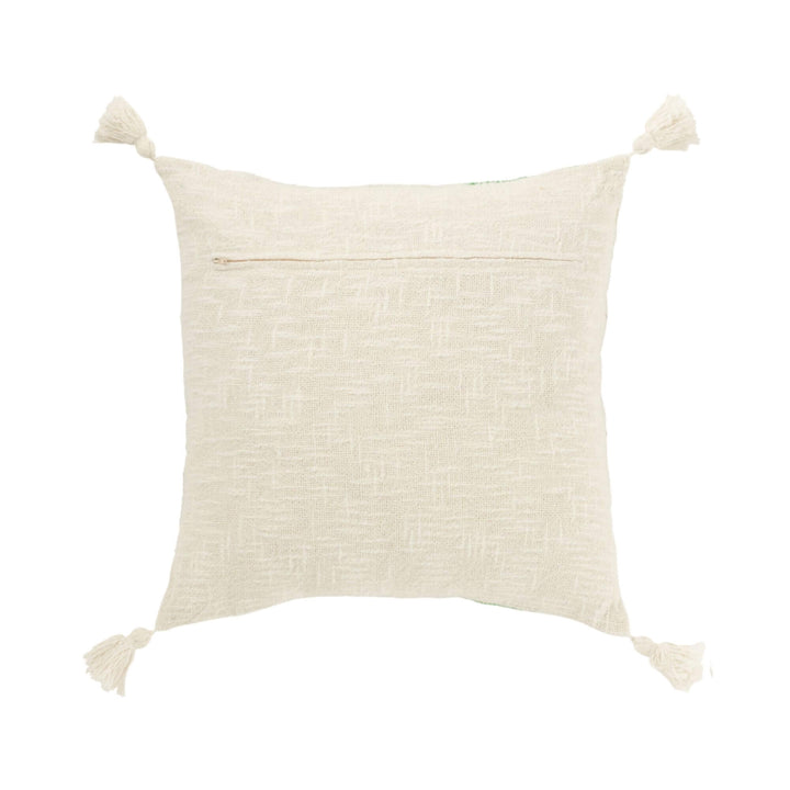 Cream cushion backside with zipper and corner tassels.