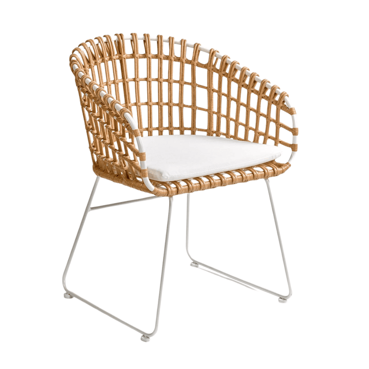 malfi dining chair front angled view with curved rattan backrest and white seat cushion.