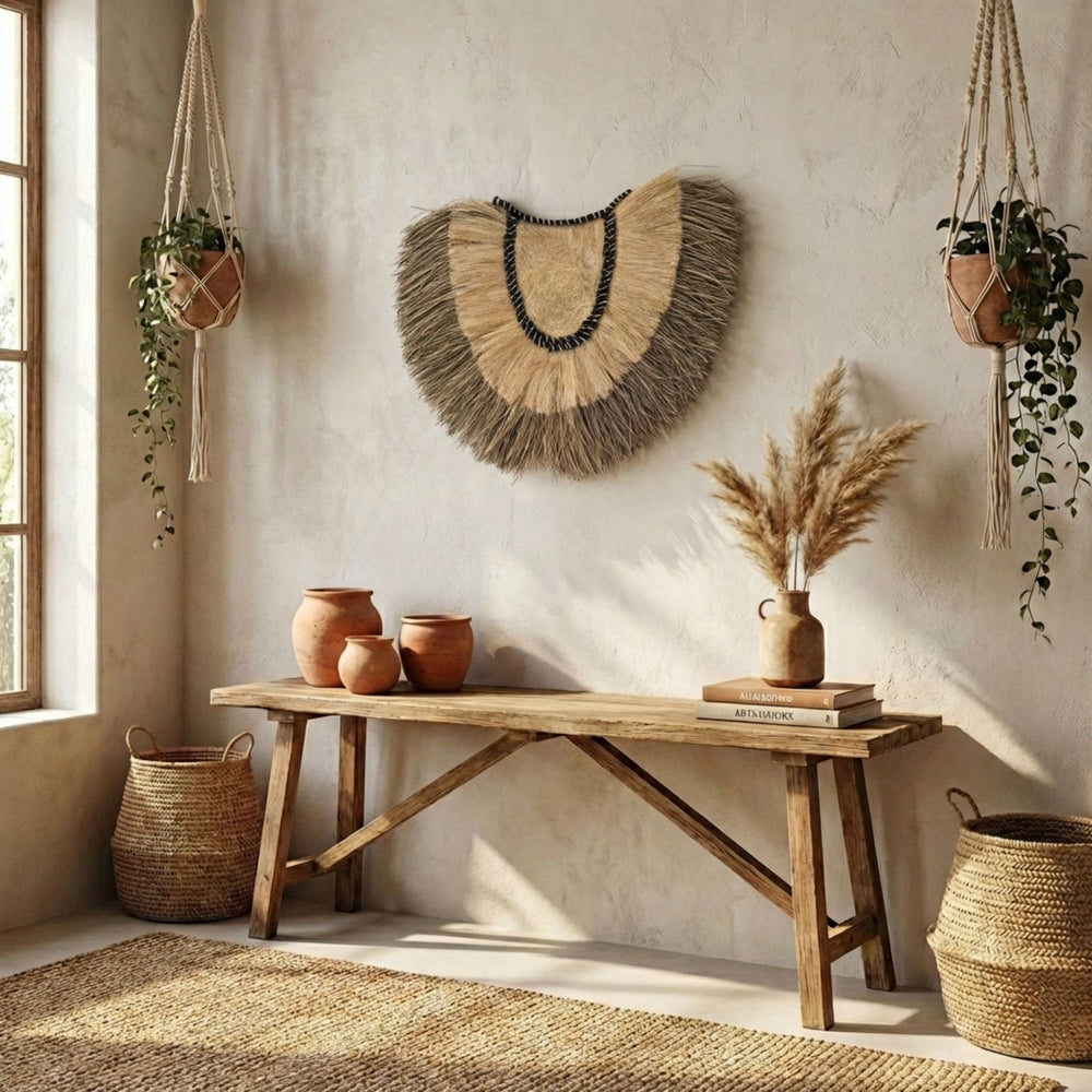 Nestled corner of a room with a wooden bench, decorative Amara wall deco, and hanging plants.