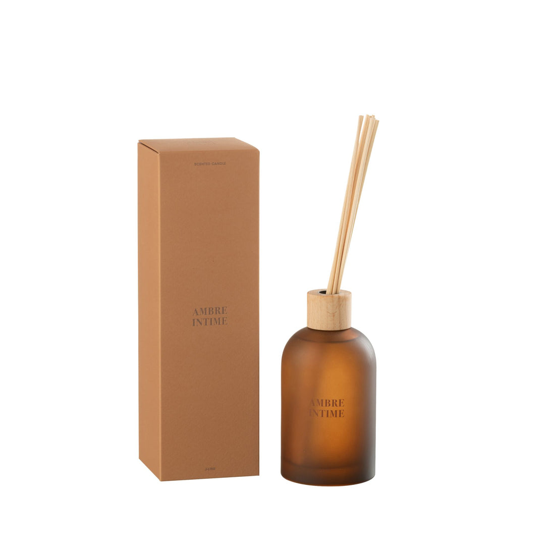Front view of the Amber Intime Diffuser with amber glass bottle and reed sticks.