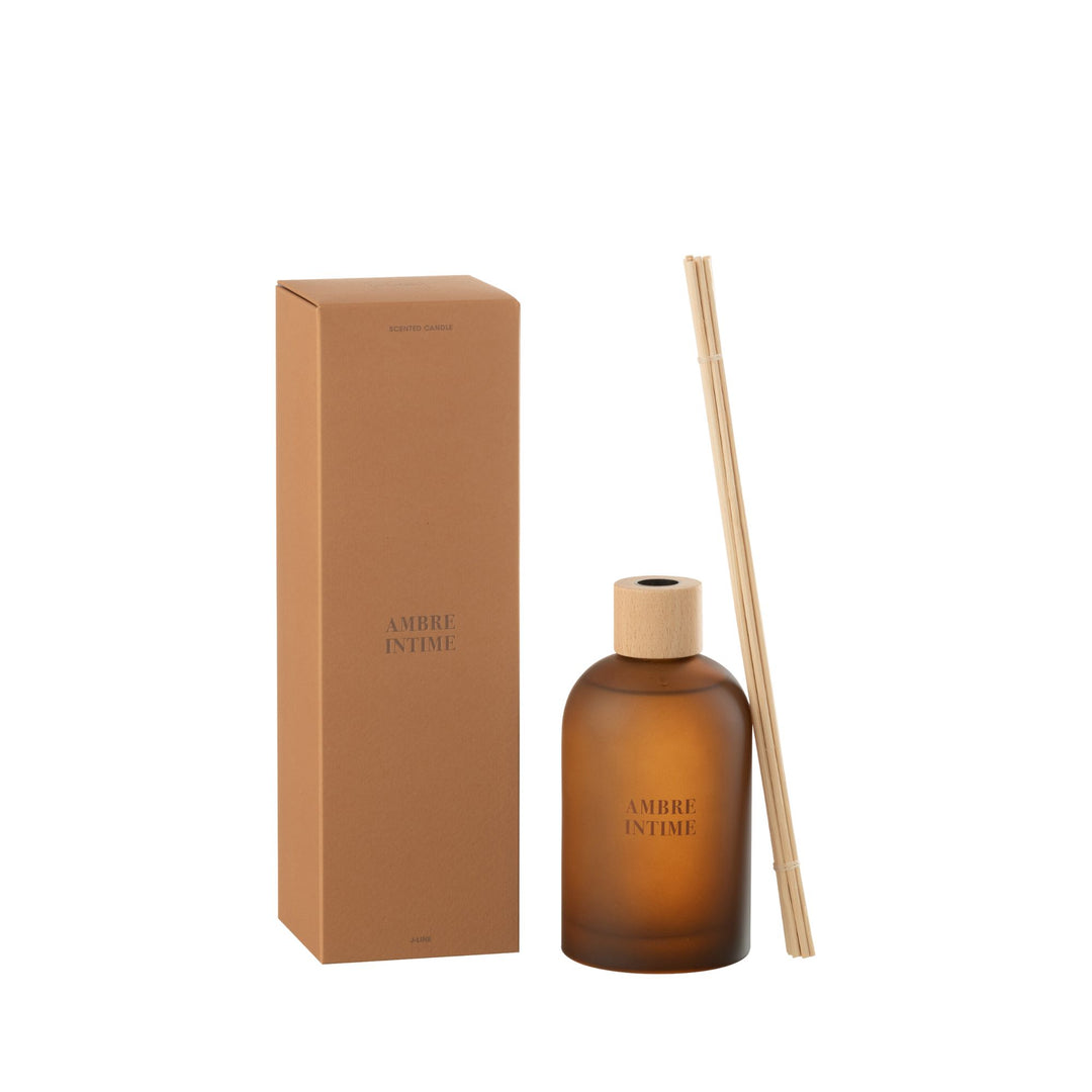 Front view of the Amber Intime Diffuser with amber glass bottle and reed sticks.