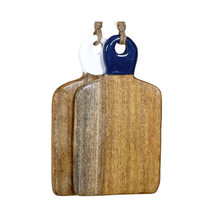 Set of two mango wood chopping boards with white and navy ceramic handles displayed together.