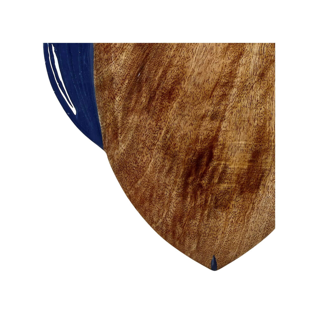 Close-up of the Anaya Fish Chopping Board showing the smooth mango wood grain and navy fin detail.