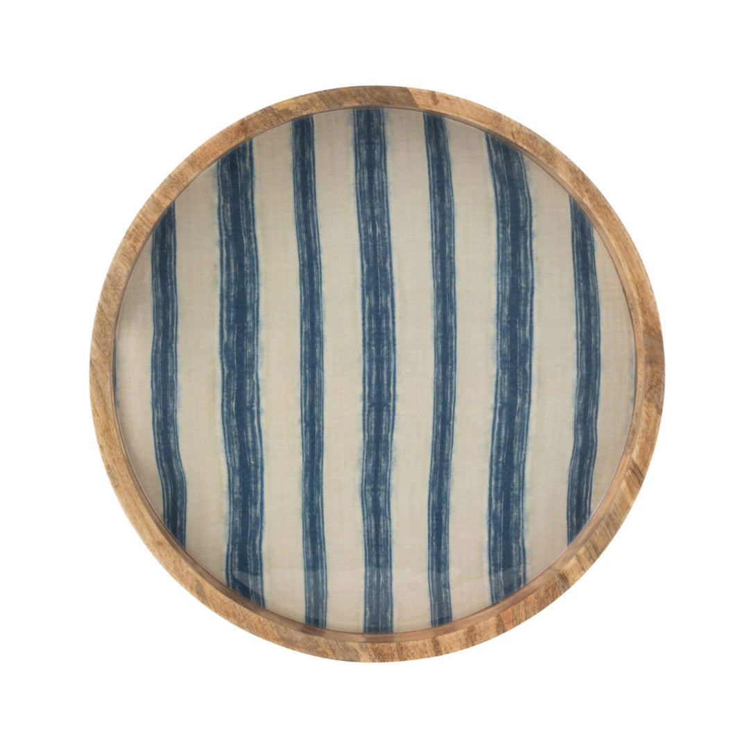 Anaya Stripes Round Tray in natural wood with blue striped pattern.