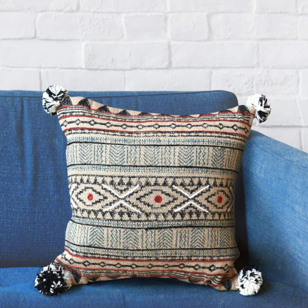 Anjuna Cushion featuring multicolor ethnic pattern and tassels.