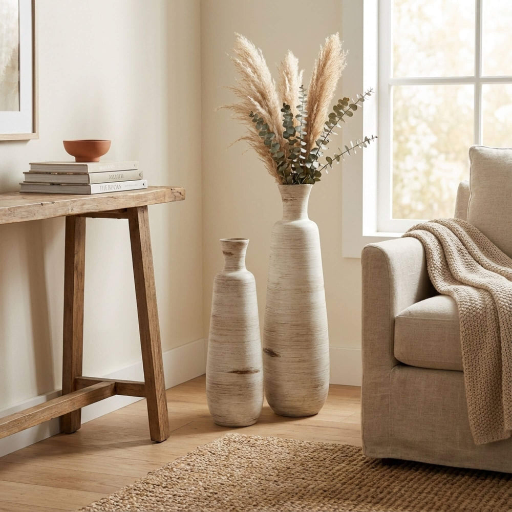 Styled interior scene with Ankara terracotta pots placed near a console table and sofa.