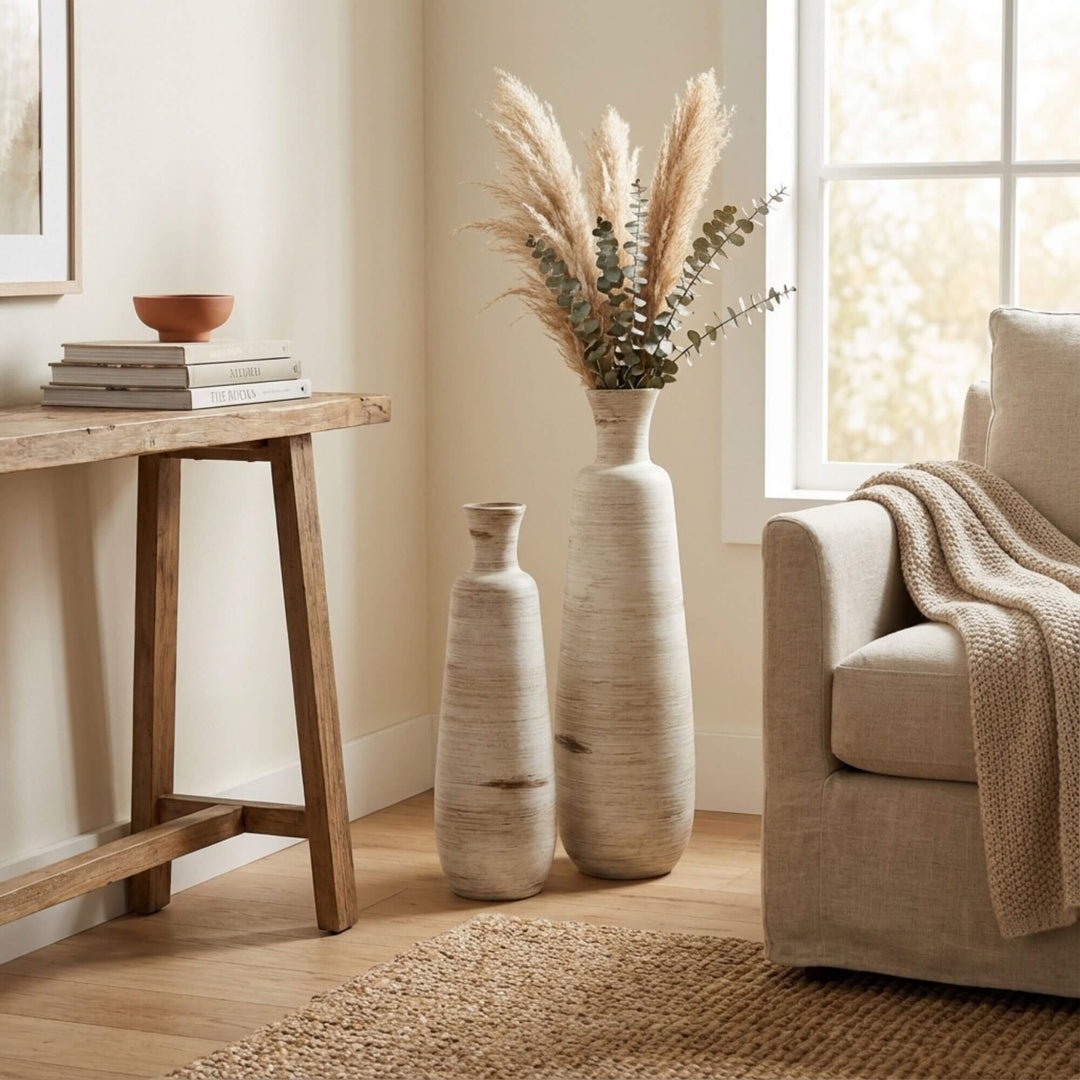 Styled interior scene with Ankara terracotta pots placed near a console table and sofa.