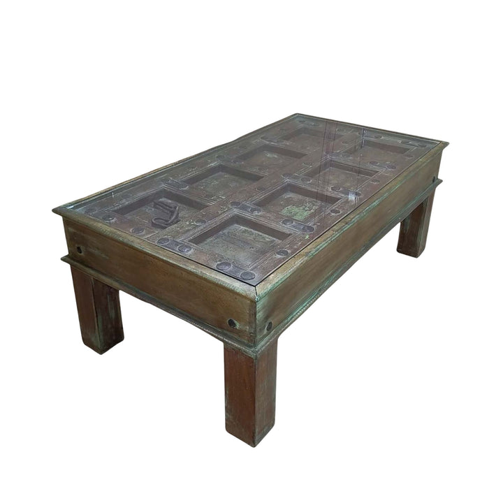 Angled view of the coffee table highlighting the reclaimed wood surface and aged patina.