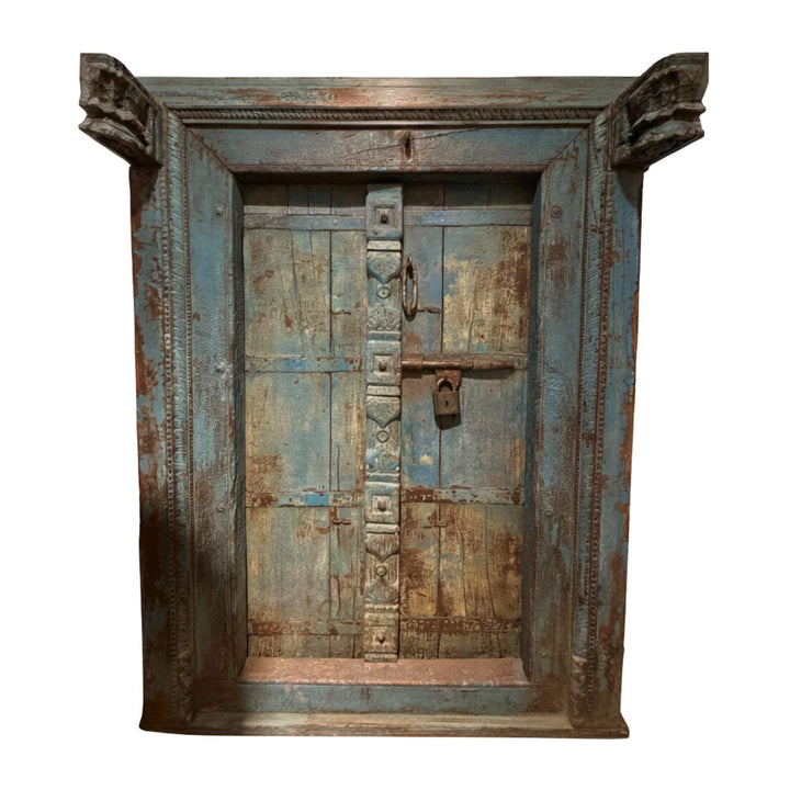 Front view of the antique Indian door in aged sheesham wood with blue patina.
