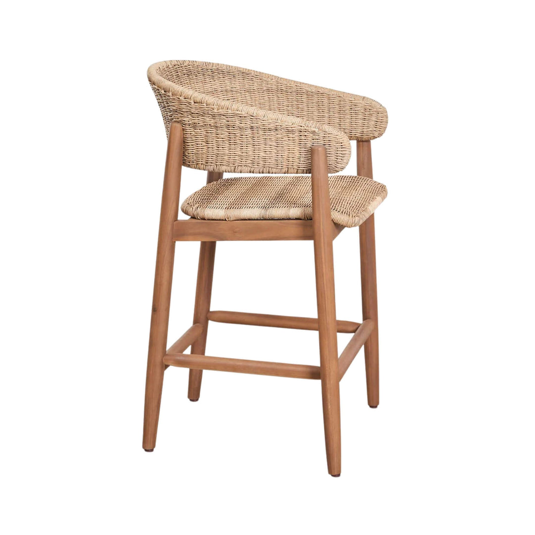 Angled view of the Arena bar stool highlighting its acacia wood frame and natural weave.