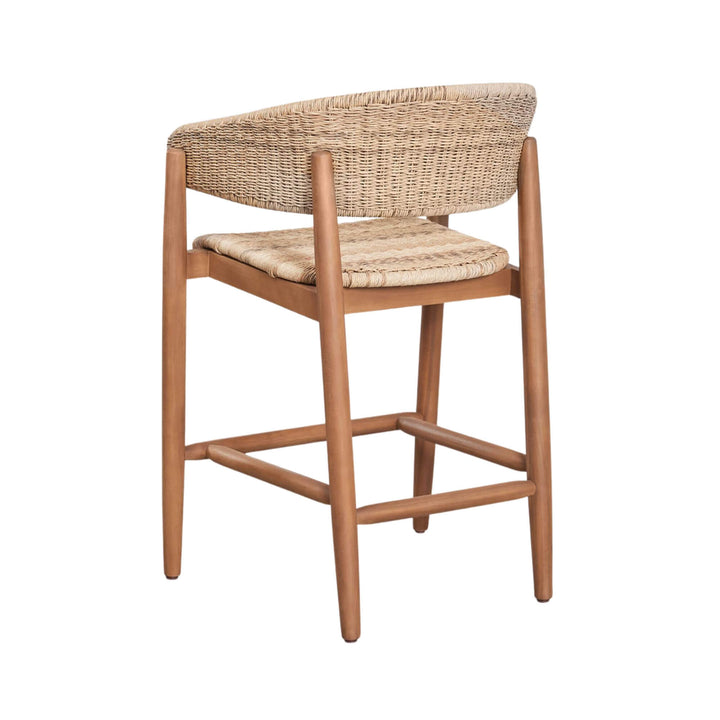 Rear three-quarter view of the stool showing the curved woven backrest and footrest structure.