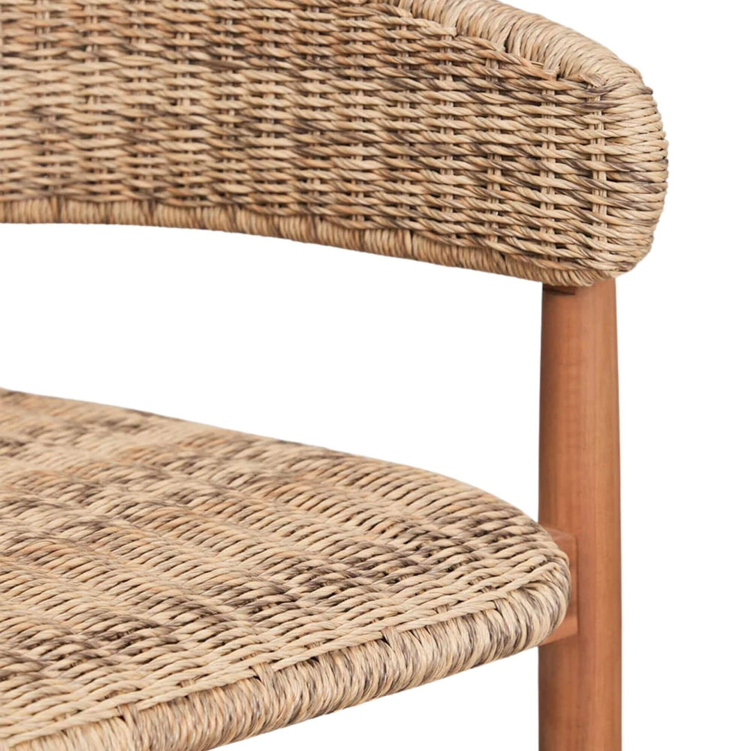 Close-up detail of the wooden footrest and tapered acacia leg.
