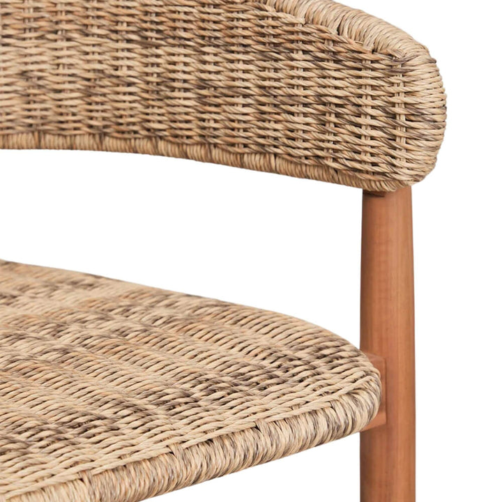 Close-up detail of the wooden footrest and tapered acacia leg.