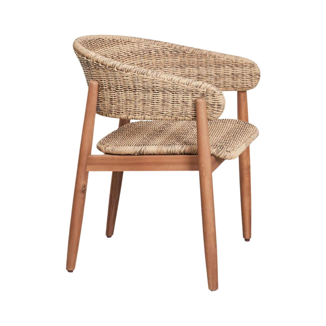 Angled view of the Arena dining chair highlighting its acacia wood frame and natural weave.