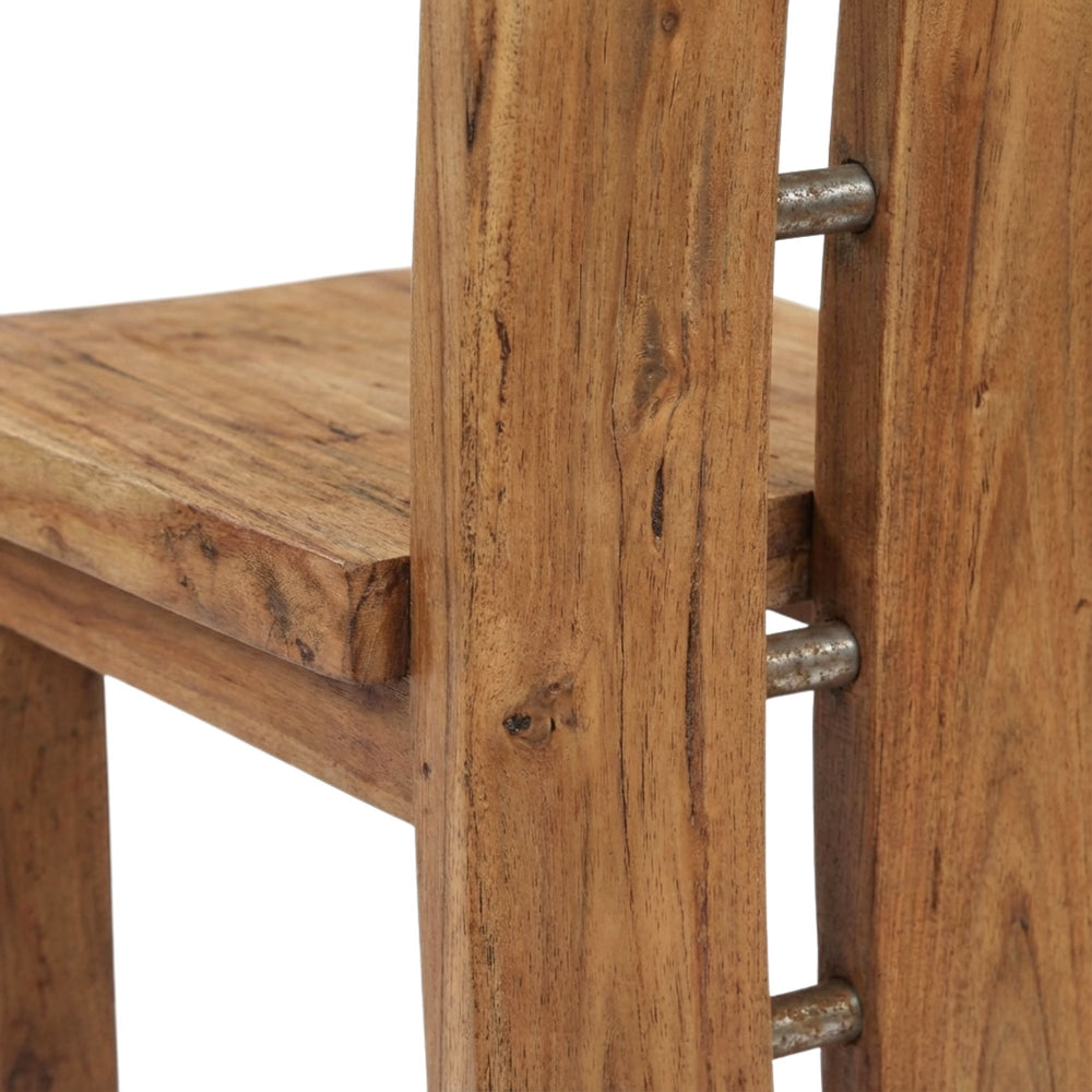 Close-up of a Argus suar wood dining chair with metal legs on a white background