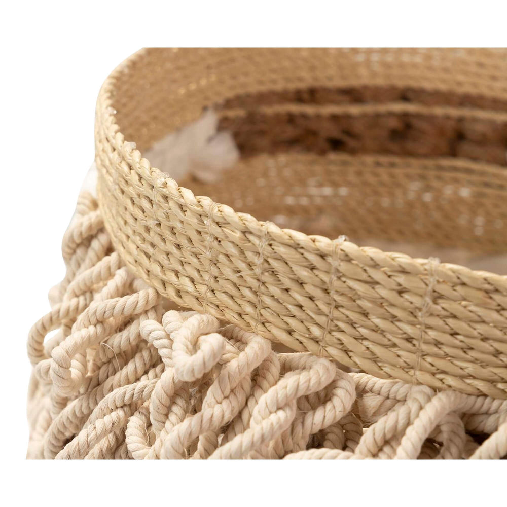 Close-up of seaweed and cotton decorative basket for home storage.