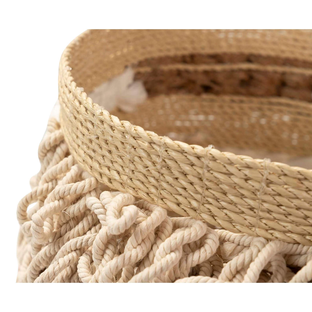 Close-up of seaweed and cotton decorative basket for home storage.