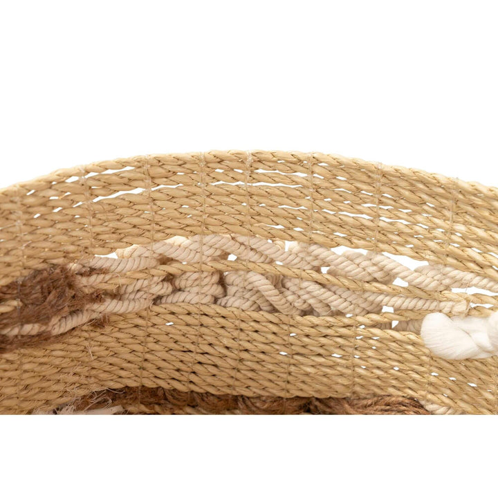 Close-up of seaweed and cotton decorative basket for home storage.