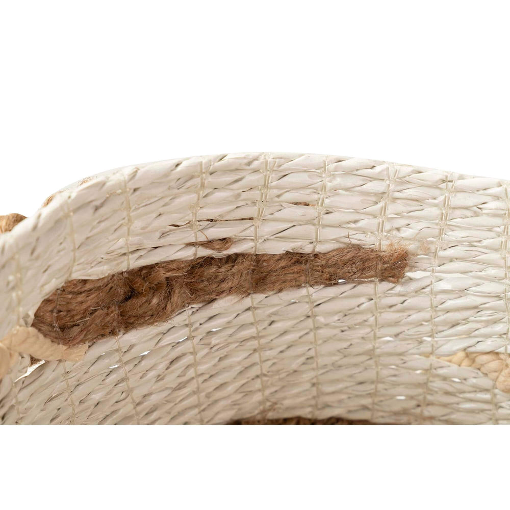 Close-up of handwoven seaweed and cotton basket with bohemian texture.

