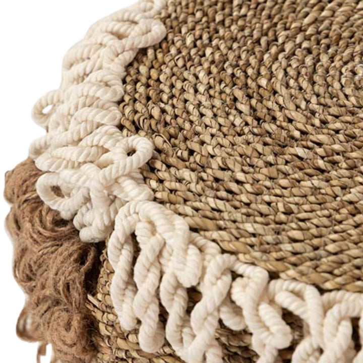 Detail of the cotton loops and textured seagrass weave on the Aroni Stool.