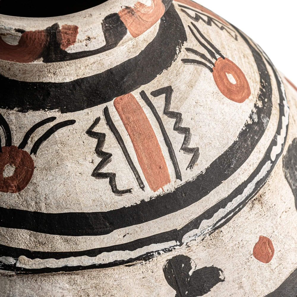 Close-up of Artemis Vase showing detailed hand-painted design and textured terracotta surface.

