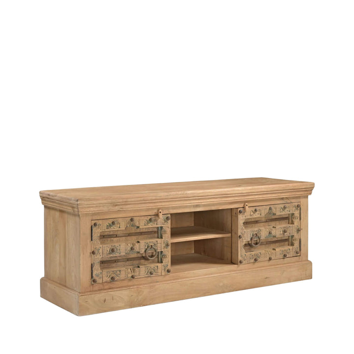 Front angled view of the Aruna Briss TV console in mango wood with decorative antique-style hardware and central open shelves