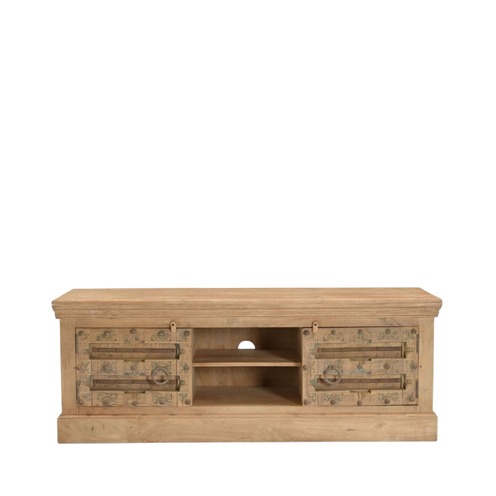 Front view of the Aruna Briss TV console showing its ornate side storage and central media shelving