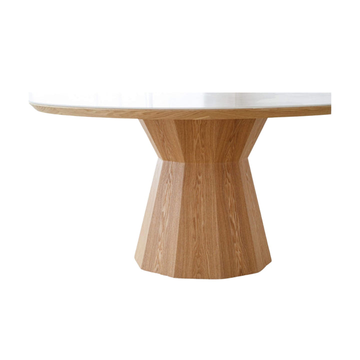 Detail of the sculpted ash veneer base of the Ash & Ceramic Dining Table