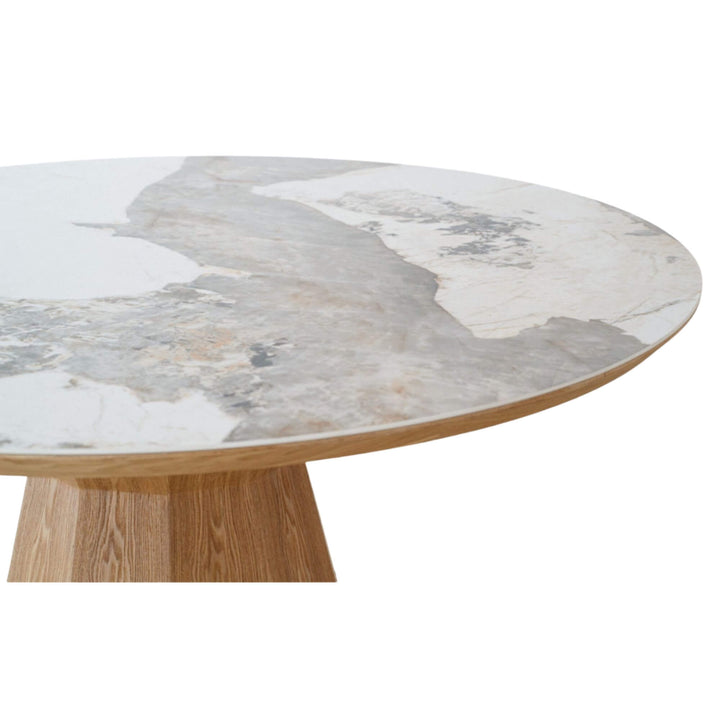 Side angle of the Ash & Ceramic Dining Table highlighting the ceramic top and wooden edge